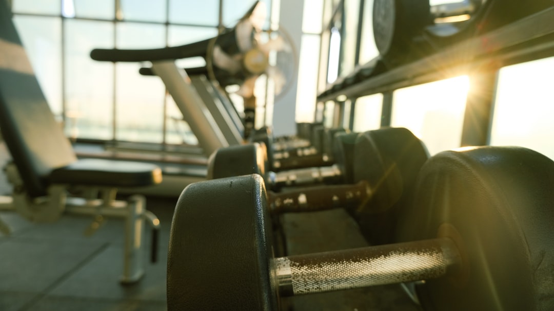 a-row-of-exercise-equipment-in-a-gym-z6cqkip-j18